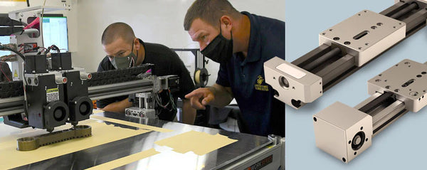 Two people working on equipment and a SIMO Linear Motion Platform